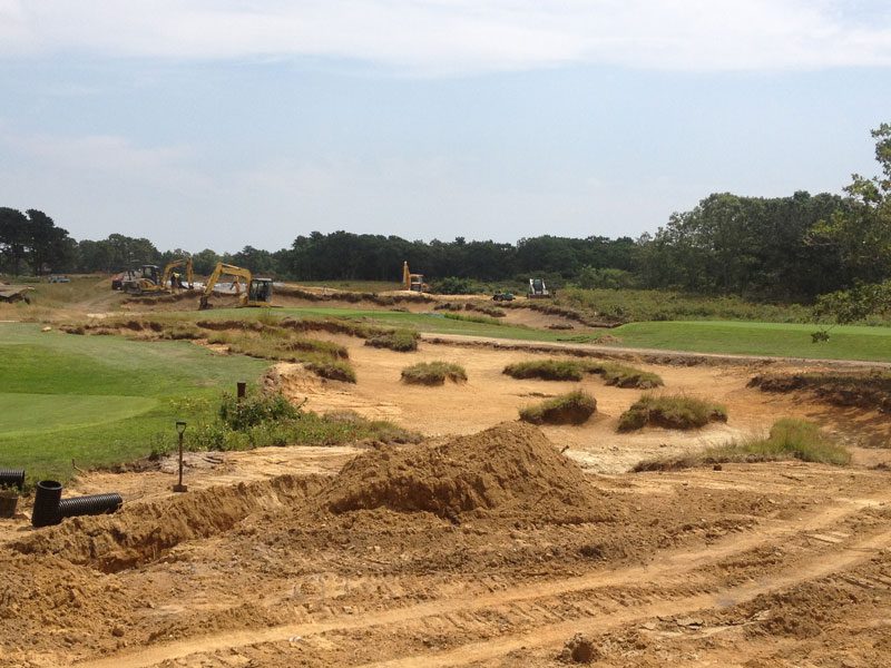 Golf course construction site with machinery